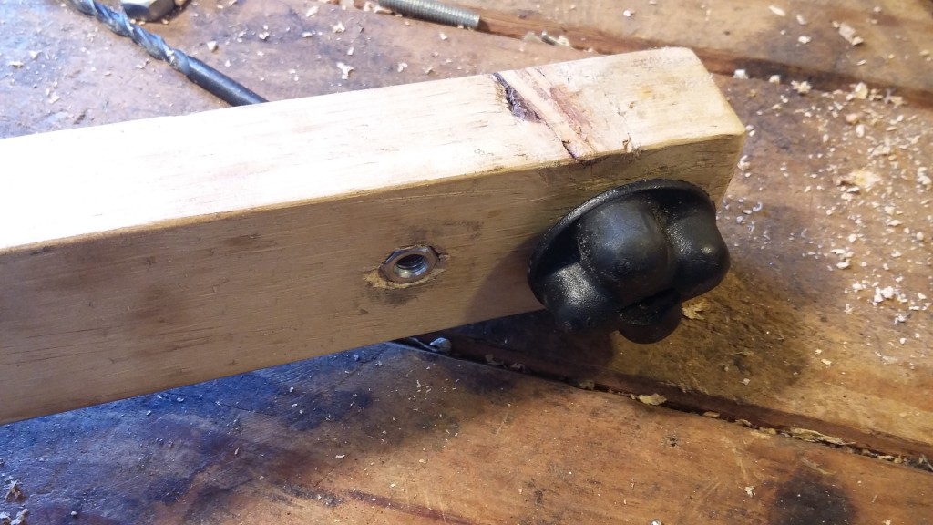 Drilled another hole and then countersunk a bolt into the wood for good measure